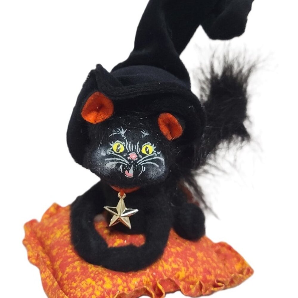 Annalee Halloween black cat sitting on an orange blanket